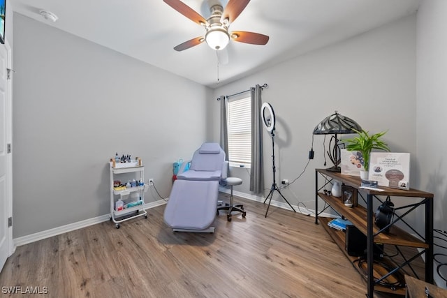 game room featuring wood-type flooring and ceiling fan