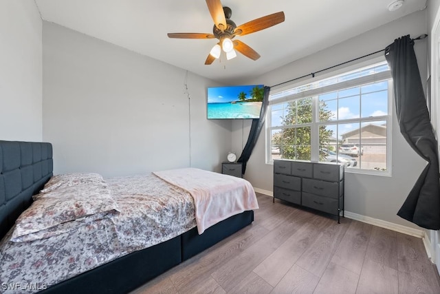 bedroom featuring wood-type flooring and ceiling fan