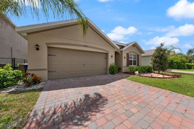 ranch-style home featuring a garage