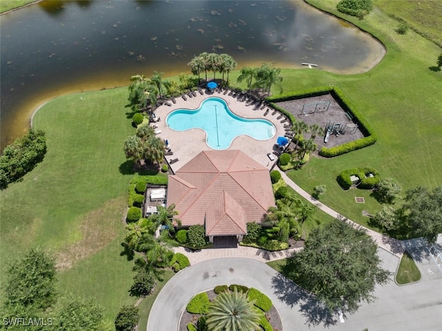 birds eye view of property with a water view