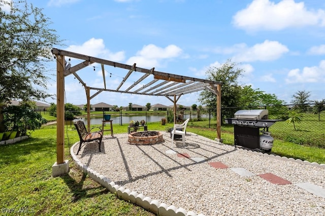 view of patio / terrace with grilling area, a water view, a pergola, and an outdoor fire pit