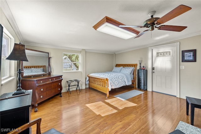 bedroom with ceiling fan, light hardwood / wood-style flooring, and ornamental molding