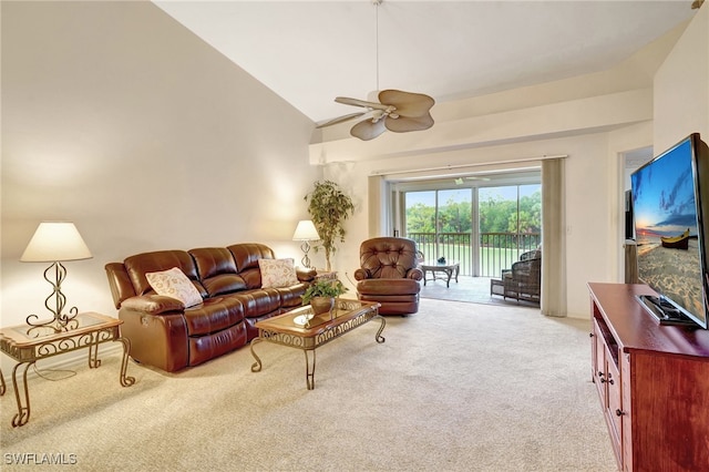 carpeted living room featuring ceiling fan and high vaulted ceiling