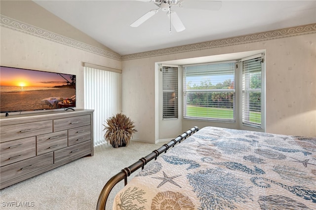 bedroom featuring lofted ceiling, carpet flooring, and ceiling fan