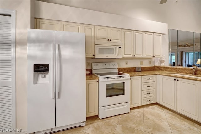 kitchen with sink, light tile patterned flooring, white appliances, and ceiling fan