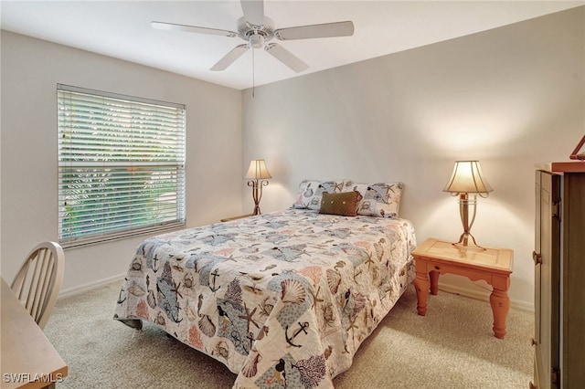 bedroom featuring ceiling fan and light carpet