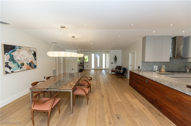 dining area with light wood-type flooring