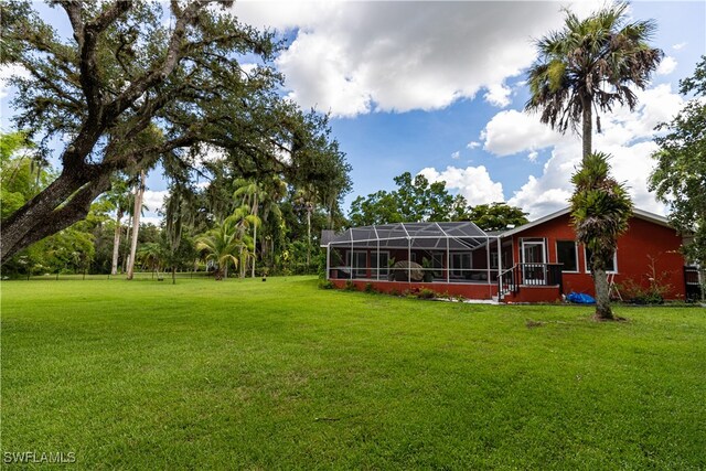 view of yard with a lanai