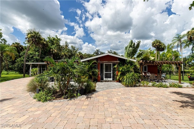 13191 Idylwild Farm Rd, Fort Myers, FL 33905 - view of outbuilding with decorative driveway and a pergola