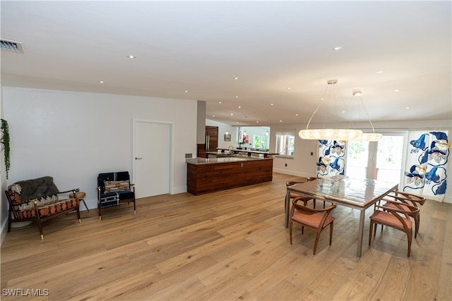 dining room with light hardwood / wood-style floors