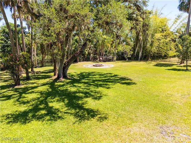 13191 Idylwild Farm Rd, Fort Myers, FL 33905 - view of yard featuring an outdoor fire pit