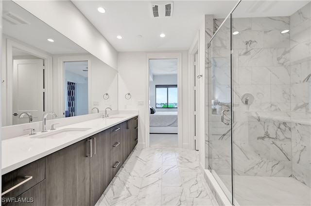 bathroom with walk in shower and vanity