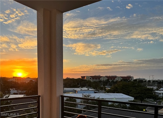 view of balcony at dusk