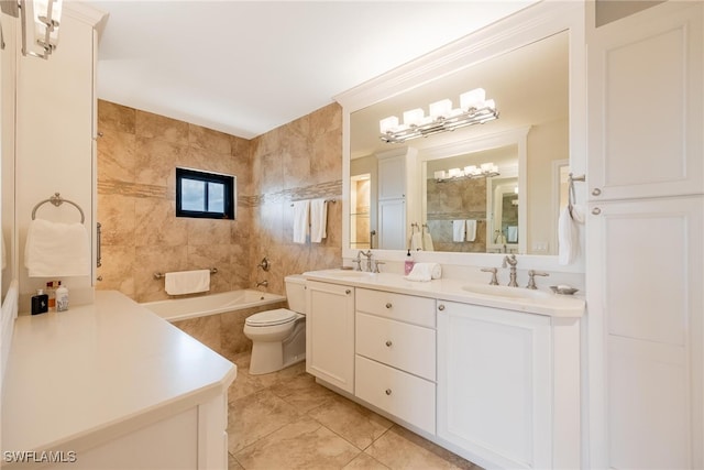 bathroom with tile patterned floors, vanity, tile walls, and toilet