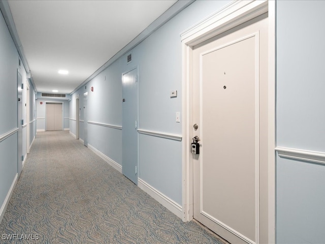 corridor featuring carpet and ornamental molding