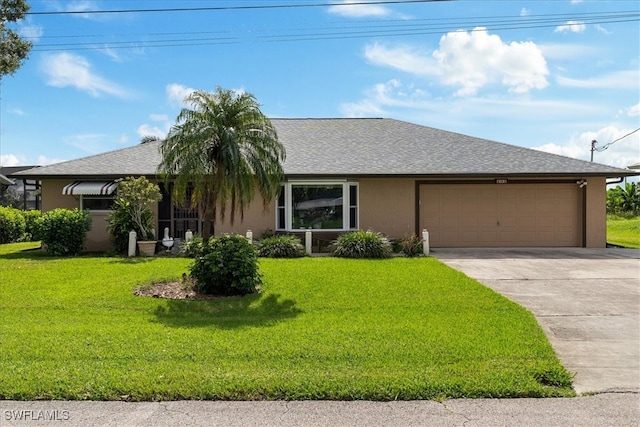 ranch-style house with a garage and a front yard