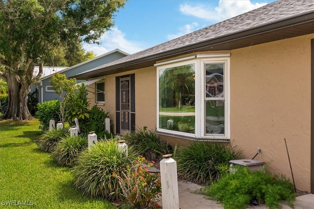 doorway to property with a yard