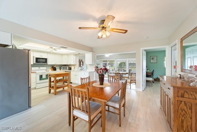 dining room featuring ceiling fan and light hardwood / wood-style floors