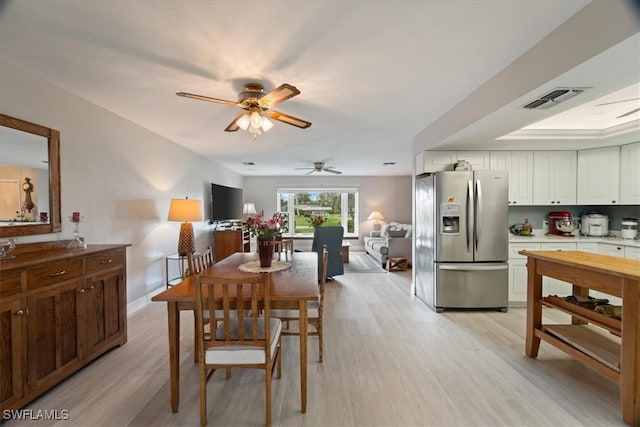 dining space featuring ceiling fan and light hardwood / wood-style flooring