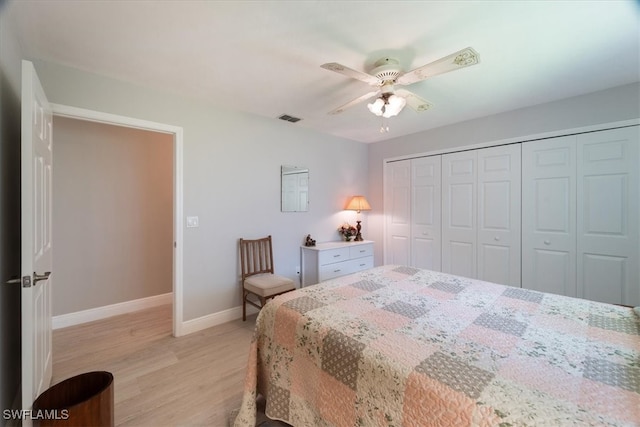 bedroom featuring a closet, light wood-type flooring, and ceiling fan