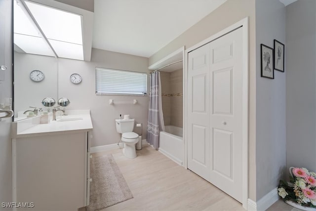 full bathroom with shower / bath combination with curtain, vanity, toilet, and hardwood / wood-style flooring