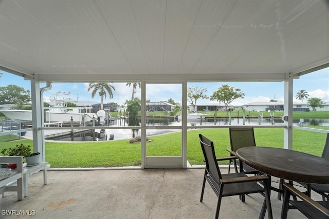 sunroom with a water view