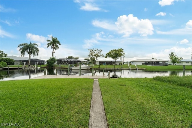 exterior space with a lawn and a water view