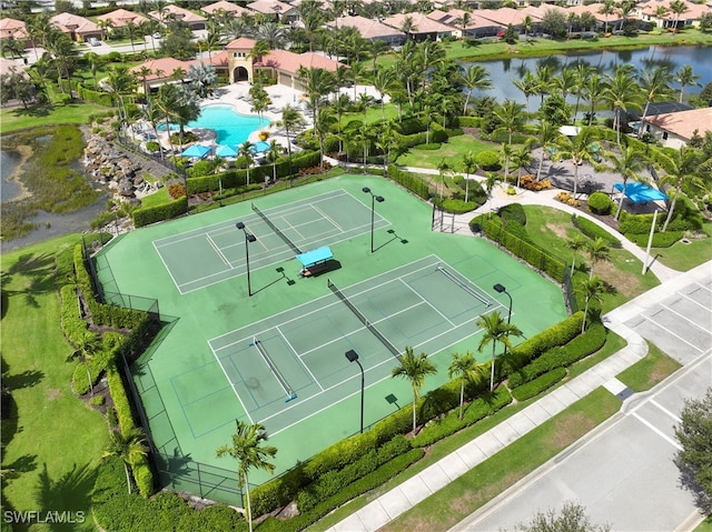 birds eye view of property with a water view