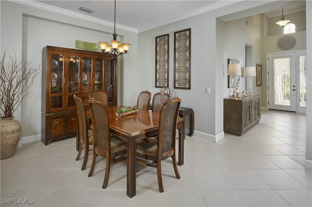 dining room featuring ornamental molding, a notable chandelier, and light tile patterned floors