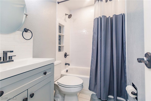 full bathroom featuring tile patterned floors, toilet, backsplash, vanity, and shower / bathtub combination with curtain