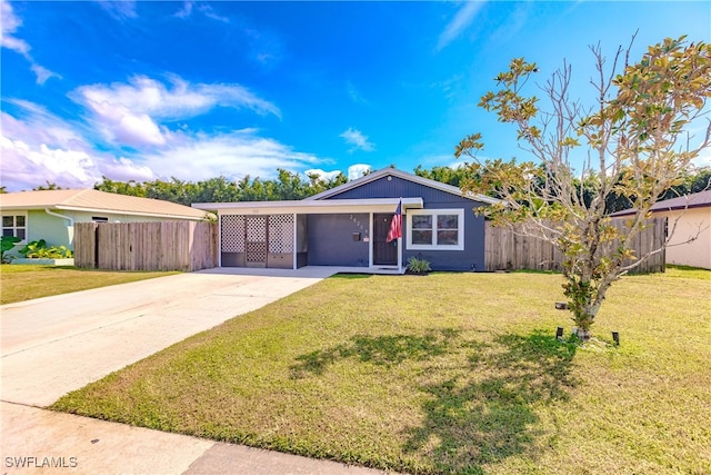 ranch-style home featuring a front yard