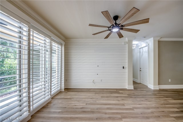 unfurnished room featuring light wood-type flooring, ceiling fan, a healthy amount of sunlight, and crown molding