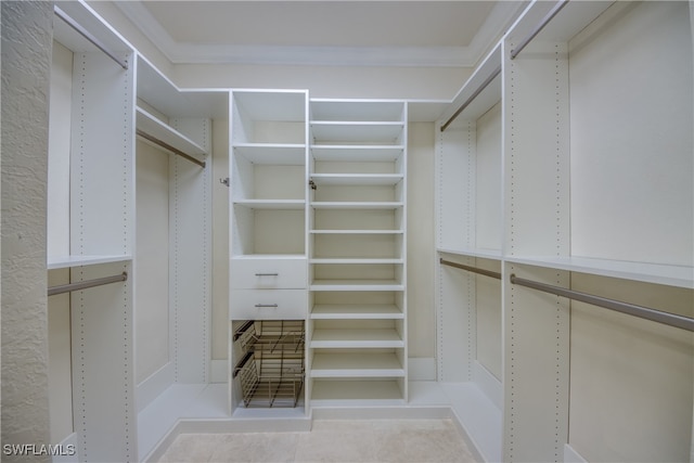 walk in closet featuring light tile patterned floors