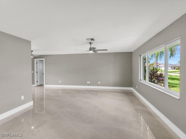 unfurnished room with ceiling fan