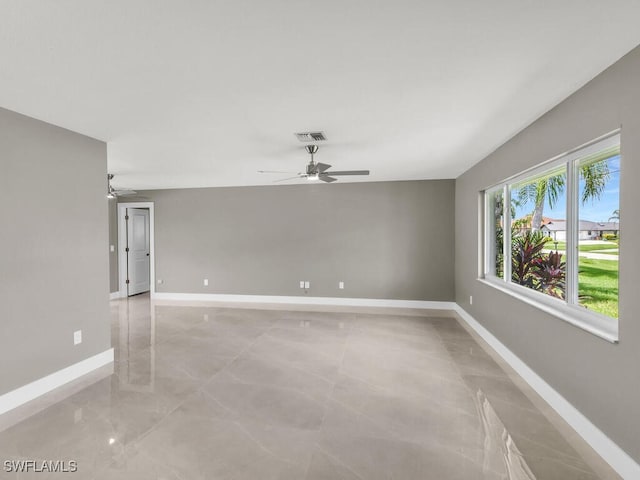 unfurnished room featuring ceiling fan