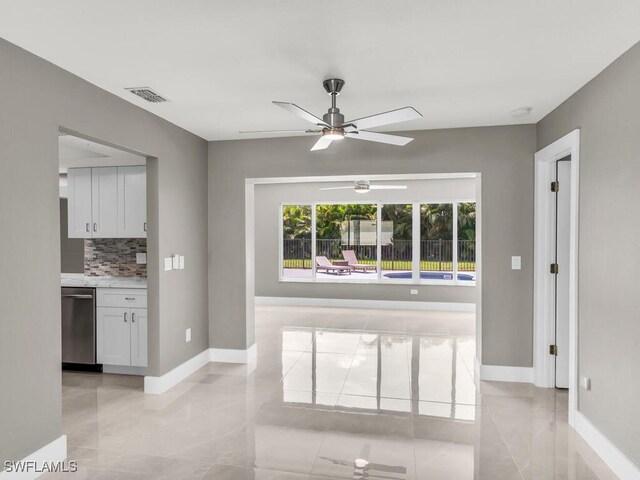 interior space featuring ceiling fan and light tile patterned flooring