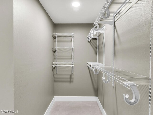 walk in closet featuring tile patterned floors