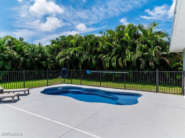 view of swimming pool with a patio