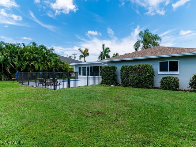 view of yard with a patio area and a fenced in pool