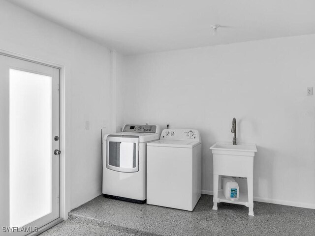 laundry room with washing machine and clothes dryer