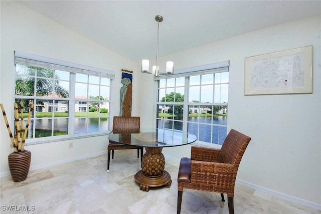 14850 Crystal Cove Ct Unit 402, Fort Myers, FL 33919 - dining area featuring baseboards, a notable chandelier, and a water view