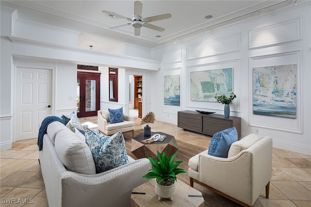 tiled living room with ornamental molding and ceiling fan