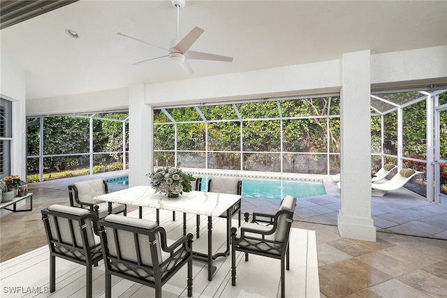 sunroom featuring ceiling fan and a wealth of natural light