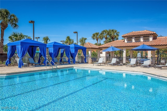 view of pool featuring a gazebo and a patio area