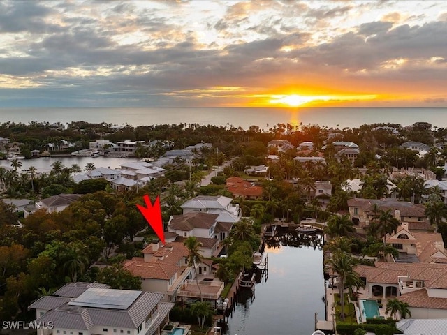 aerial view at dusk with a water view