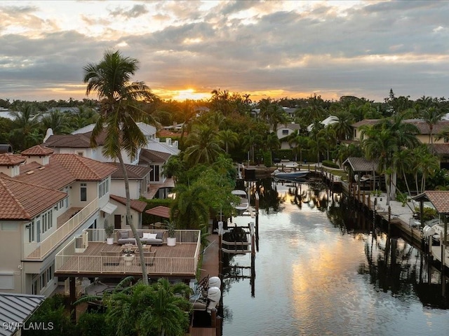 aerial view at dusk with a water view