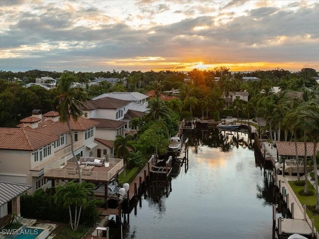 aerial view at dusk with a water view