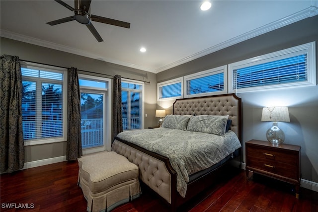 bedroom with dark hardwood / wood-style flooring, crown molding, and ceiling fan