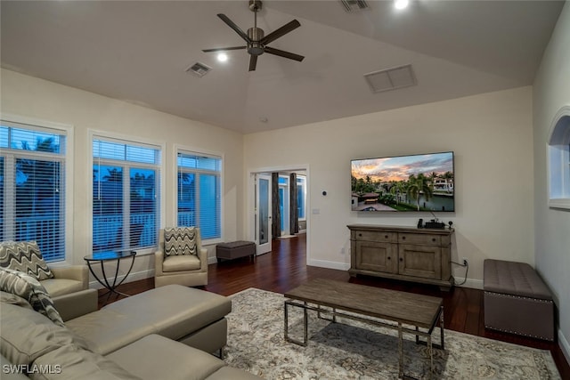 living room with ceiling fan, dark hardwood / wood-style floors, and high vaulted ceiling