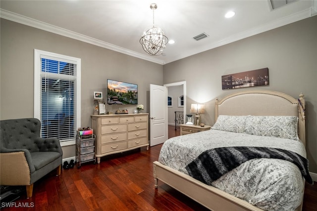 bedroom with an inviting chandelier, ornamental molding, and dark hardwood / wood-style floors